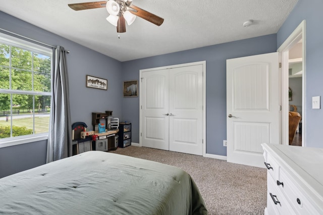 1014 Gill Hodges Rd, Portland, TN 37148 - bedroom featuring carpet, a closet, baseboards, a ceiling fan, and a textured ceiling