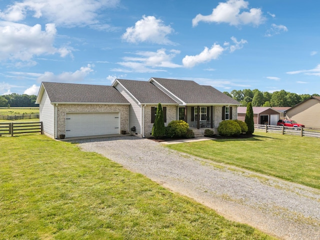 1014 Gill Hodges Rd, Portland, TN 37148 - single story home with driveway, a garage, brick siding, and roof with shingles