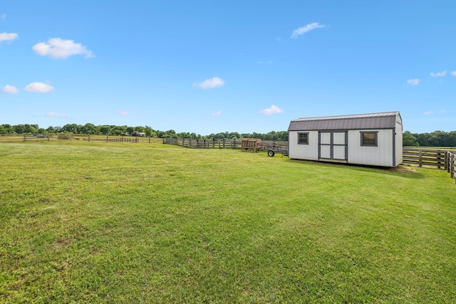 1014 Gill Hodges Rd, Portland, TN 37148 - view of yard featuring a storage unit, an outbuilding, and a view of rural / pastoral area
