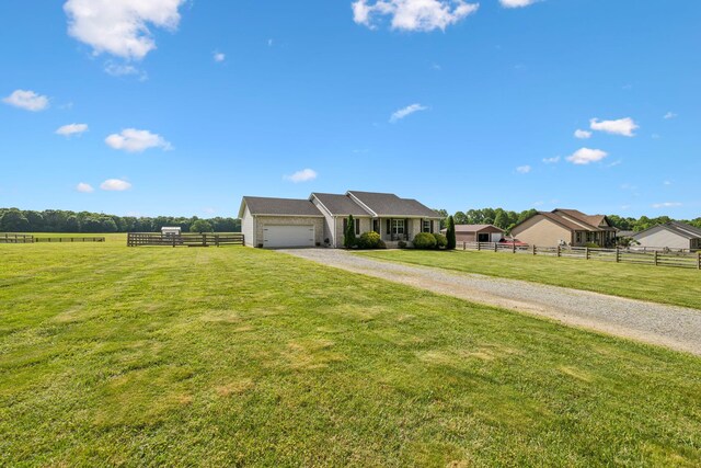1014 Gill Hodges Rd, Portland, TN 37148 - ranch-style home with gravel driveway and a garage