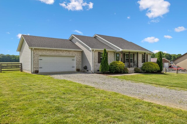 1014 Gill Hodges Rd, Portland, TN 37148 - ranch-style home with gravel driveway, an attached garage, brick siding, and roof with shingles