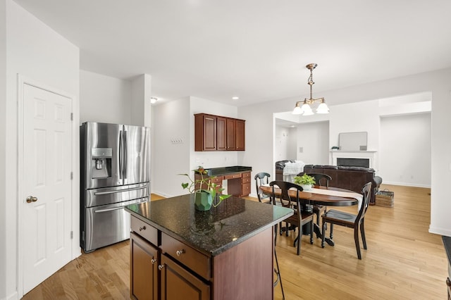 1201 Banbury Row, Brentwood, TN 37027 - kitchen with stainless steel fridge with ice dispenser, light wood-style floors, a fireplace, a center island, and open floor plan