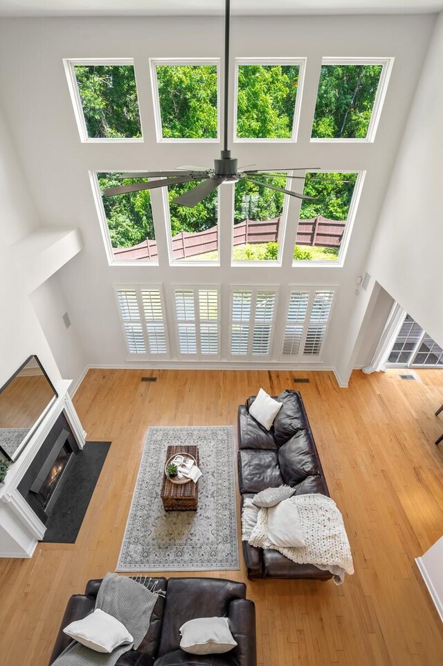 1201 Banbury Row, Brentwood, TN 37027 - living room with plenty of natural light, wood finished floors, a high ceiling, and a fireplace with flush hearth