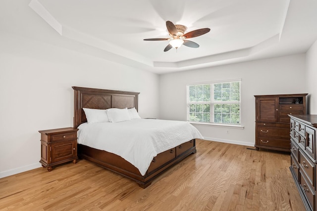 1201 Banbury Row, Brentwood, TN 37027 - bedroom with a tray ceiling, light wood-type flooring, baseboards, and a ceiling fan