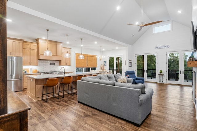 314 N Porter St, Winchester, TN 37398 - living room featuring plenty of natural light, wood finished floors, high vaulted ceiling, french doors, and recessed lighting