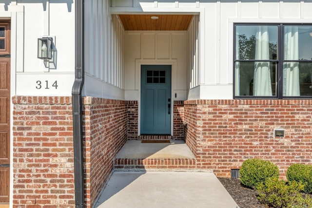 314 N Porter St, Winchester, TN 37398 - doorway to property with brick siding and board and batten siding