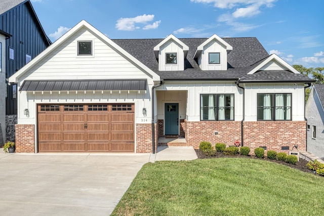 314 N Porter St, Winchester, TN 37398 - modern farmhouse style home featuring board and batten siding, driveway, a shingled roof, a front yard, and brick siding