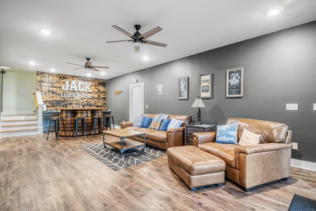 314 N Porter St, Winchester, TN 37398 - living area featuring a bar, wood finished floors, recessed lighting, ceiling fan, and stairway