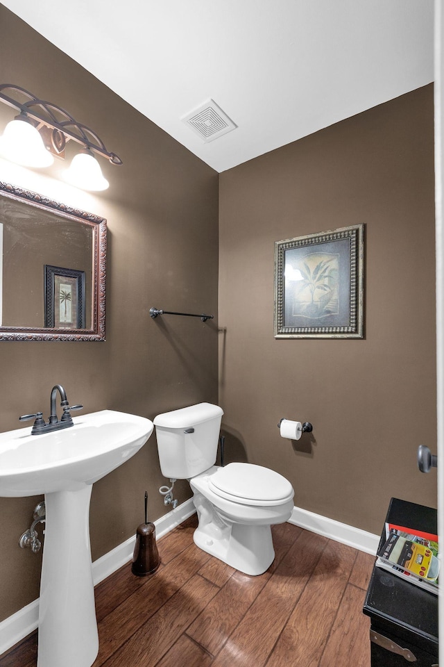 1325 Branchside Ct, Thompsons Station, TN 37179 - half bathroom with toilet, wood finished floors, baseboards, and a sink