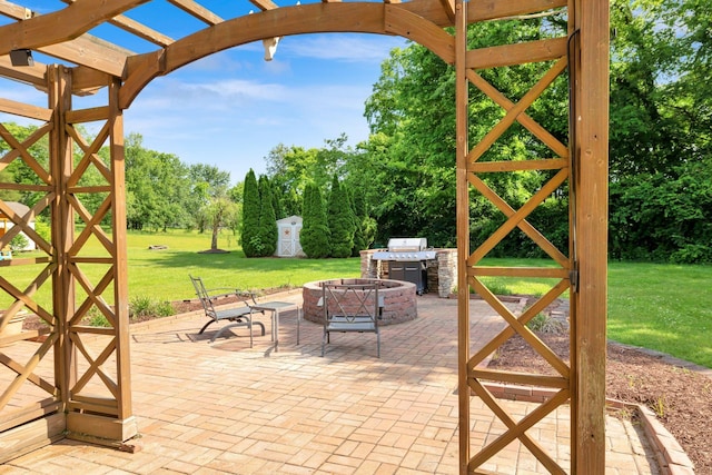 1325 Branchside Ct, Thompsons Station, TN 37179 - view of patio with an outdoor fire pit, a grill, a pergola, view of scattered trees, and an outbuilding