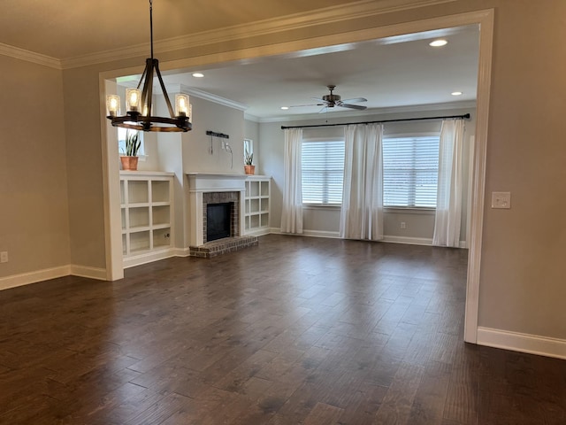 4724 Kingdom Dr, Murfreesboro, TN 37128 - unfurnished living room with ornamental molding, dark wood finished floors, a chandelier, a ceiling fan, and a brick fireplace