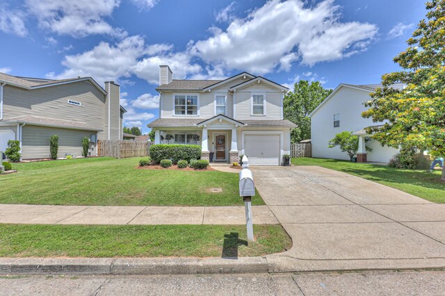1753 Stone Hollow Ct, Hermitage, TN 37076 - view of front of property with driveway, a garage, a chimney, and a shingled roof