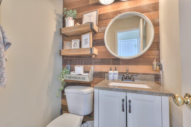 1753 Stone Hollow Ct, Hermitage, TN 37076 - half bathroom with wood walls, vanity, and toilet