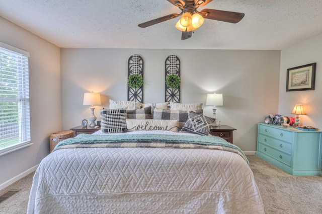 1753 Stone Hollow Ct, Hermitage, TN 37076 - bedroom with carpet, multiple windows, a textured ceiling, ceiling fan, and baseboards