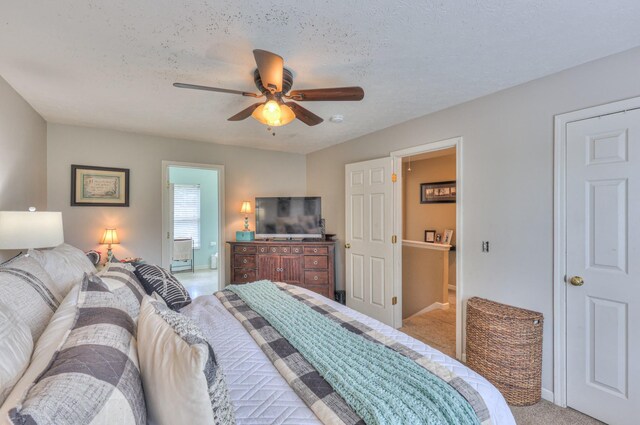 1753 Stone Hollow Ct, Hermitage, TN 37076 - bedroom featuring light colored carpet, ensuite bathroom, a ceiling fan, baseboards, and a textured ceiling