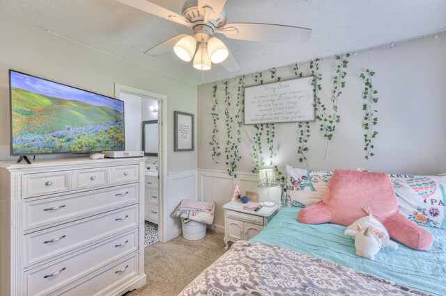 1753 Stone Hollow Ct, Hermitage, TN 37076 - bedroom with carpet floors, connected bathroom, ceiling fan, and wainscoting