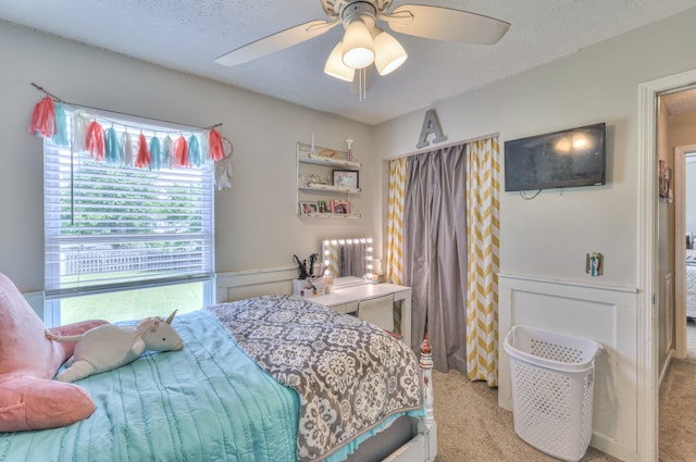 1753 Stone Hollow Ct, Hermitage, TN 37076 - carpeted bedroom featuring a ceiling fan, a textured ceiling, and wainscoting