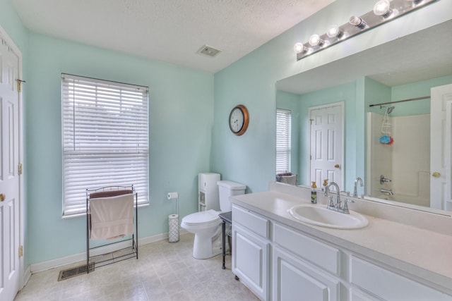 1753 Stone Hollow Ct, Hermitage, TN 37076 - full bath featuring toilet, a shower, plenty of natural light, vanity, and a textured ceiling