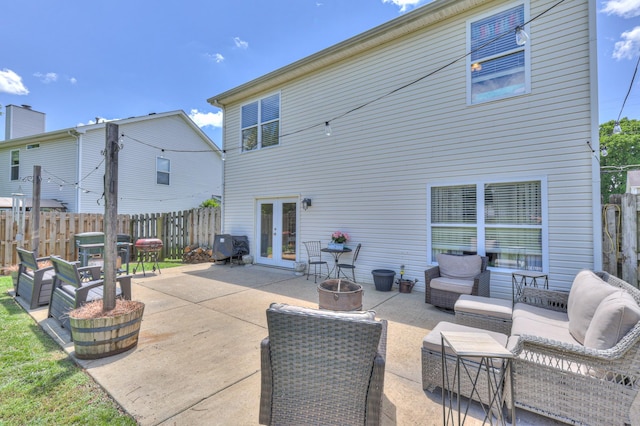 1753 Stone Hollow Ct, Hermitage, TN 37076 - rear view of house with french doors, a patio area, and an outdoor living space