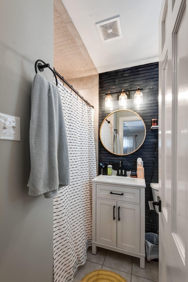 111 Proffitt St, Carthage, TN 37030 - bathroom with tile walls, tile patterned floors, vanity, curtained shower, and toilet
