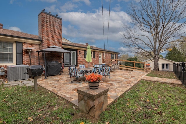 111 Proffitt St, Carthage, TN 37030 - view of patio featuring grilling area, central AC, and fence