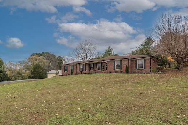 111 Proffitt St, Carthage, TN 37030 - single story home with brick siding, a front yard, and driveway