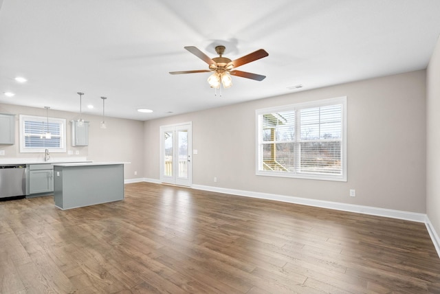 230 Cardinal Crk, Clarksville, TN 37040 - unfurnished living room with baseboards, ceiling fan, wood finished floors, and recessed lighting