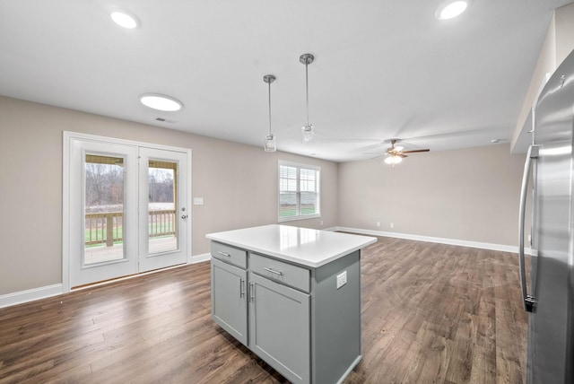 230 Cardinal Crk, Clarksville, TN 37040 - kitchen with gray cabinetry, stainless steel refrigerator, ceiling fan, dark wood-type flooring, and pendant lighting