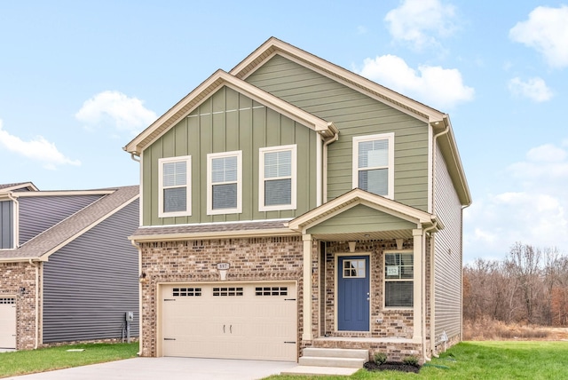 230 Cardinal Crk, Clarksville, TN 37040 - view of front of house with an attached garage, concrete driveway, board and batten siding, and brick siding