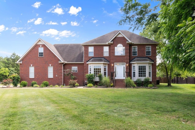 134 Blackberry Ln, Murfreesboro, TN 37130 - view of front of property featuring brick siding, a front lawn, and roof with shingles