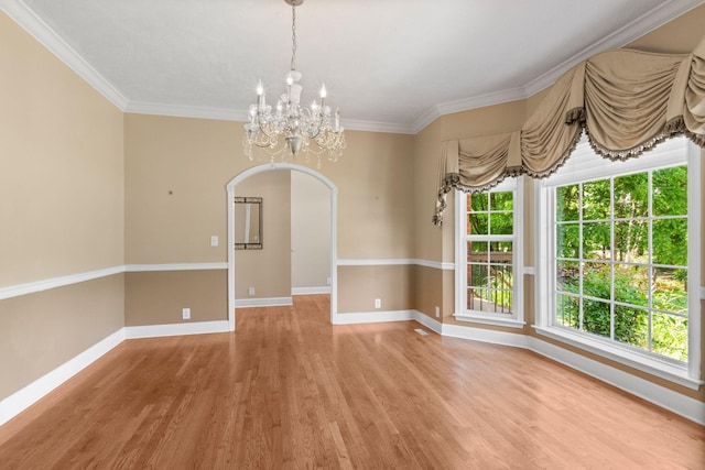 134 Blackberry Ln, Murfreesboro, TN 37130 - unfurnished dining area featuring a chandelier, arched walkways, light wood-style flooring, baseboards, and ornamental molding