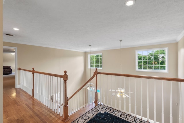 134 Blackberry Ln, Murfreesboro, TN 37130 - hall with an upstairs landing, crown molding, a textured ceiling, wood finished floors, and recessed lighting