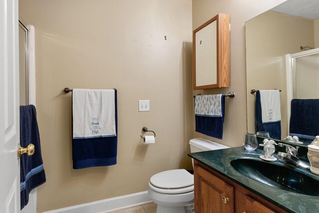 134 Blackberry Ln, Murfreesboro, TN 37130 - bathroom with a stall shower, vanity, toilet, tile patterned floors, and baseboards