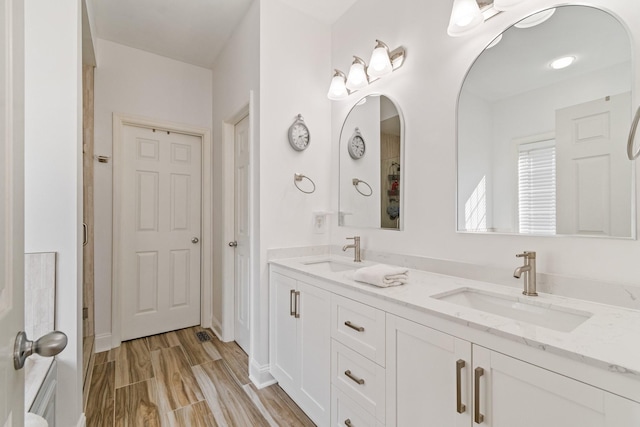 1505 Charleston Park Dr, Spring Hill, TN 37174 - bathroom with double vanity and wood finished floors