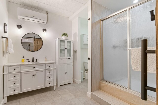 1505 Charleston Park Dr, Spring Hill, TN 37174 - bathroom with a wall unit AC, a shower stall, vanity, toilet, and tile patterned floors