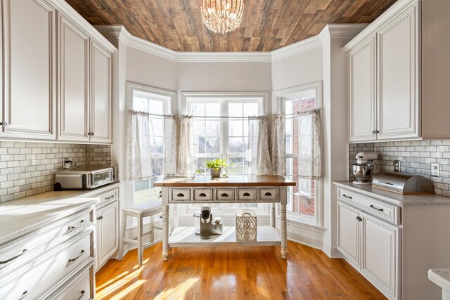 1505 Charleston Park Dr, Spring Hill, TN 37174 - kitchen with wood ceiling, light countertops, a chandelier, healthy amount of natural light, and white cabinets