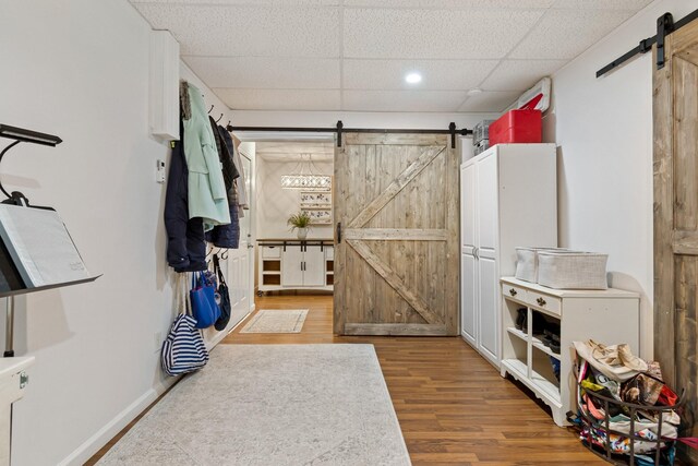 1505 Charleston Park Dr, Spring Hill, TN 37174 - entryway featuring a barn door, wood finished floors, and a drop ceiling