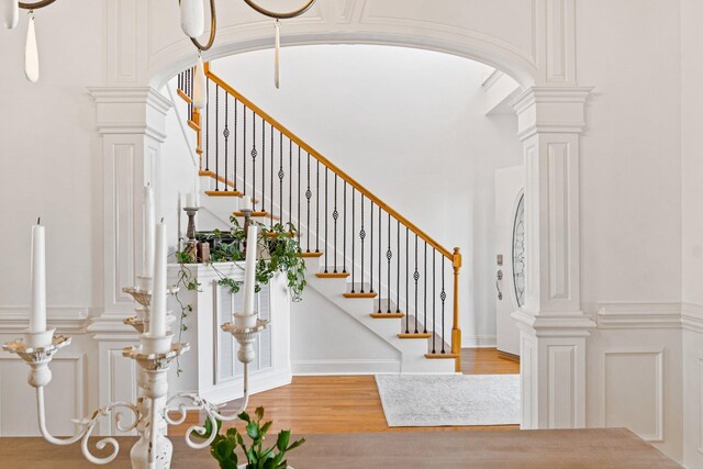 1505 Charleston Park Dr, Spring Hill, TN 37174 - stairway featuring ornate columns, arched walkways, and wood finished floors