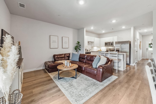 105 Grayson Cir, Chapel Hill, TN 37034 - living room with light wood-type flooring, baseboards, and recessed lighting