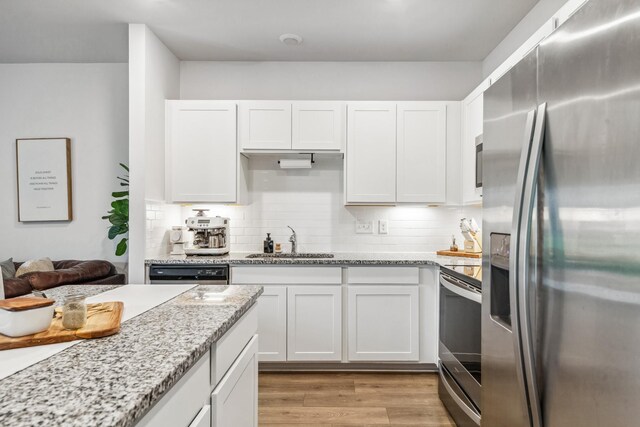 105 Grayson Cir, Chapel Hill, TN 37034 - kitchen featuring stainless steel appliances, a sink, white cabinets, and decorative backsplash