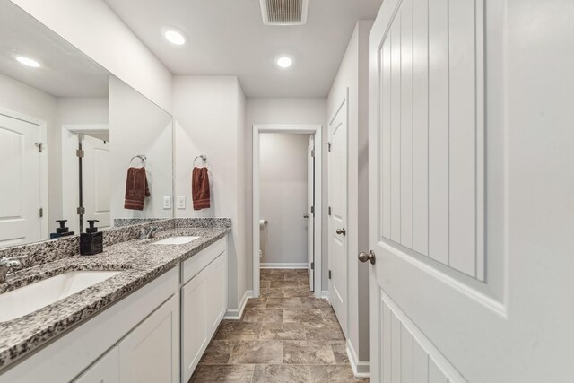 105 Grayson Cir, Chapel Hill, TN 37034 - bathroom with baseboards, toilet, double vanity, recessed lighting, and stone finish floors