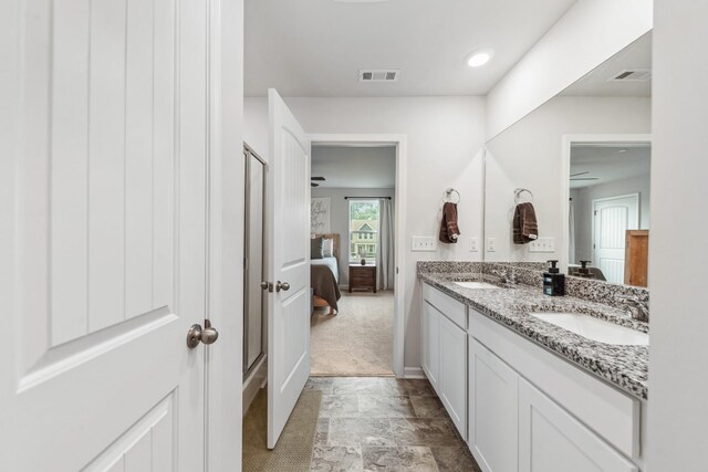105 Grayson Cir, Chapel Hill, TN 37034 - bathroom with double vanity, ensuite bathroom, baseboards, and stone finish floors