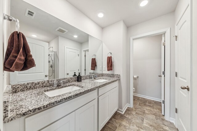 105 Grayson Cir, Chapel Hill, TN 37034 - bathroom with toilet, baseboards, double vanity, and recessed lighting