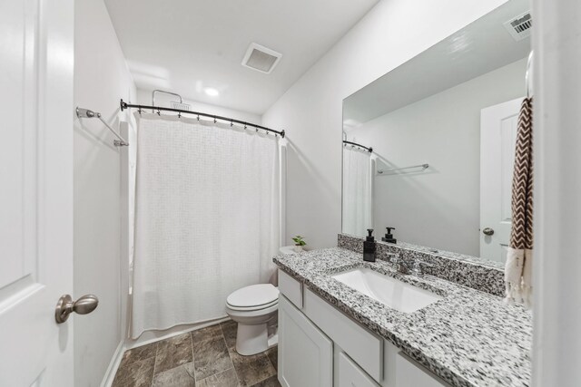 105 Grayson Cir, Chapel Hill, TN 37034 - bathroom with toilet, vanity, stone finish flooring, and shower / tub combo