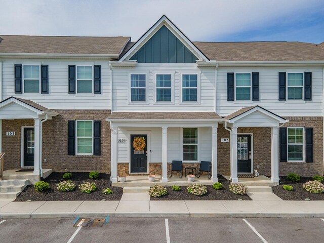 105 Grayson Cir, Chapel Hill, TN 37034 - multi unit property with uncovered parking, board and batten siding, a porch, and brick siding