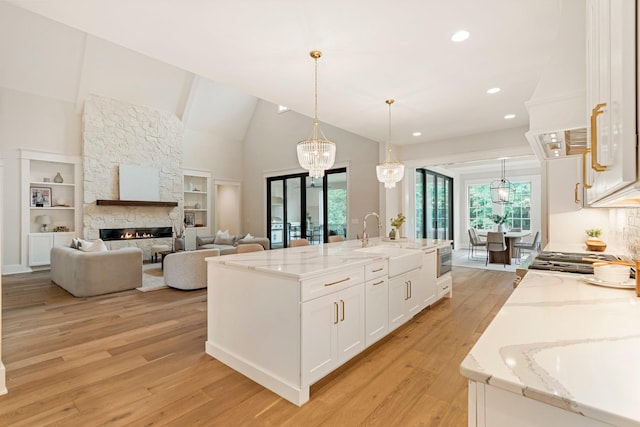 4617 Delta Springs Ln, Franklin, TN 37064 - kitchen with a sink, plenty of natural light, white cabinets, light wood-style floors, and recessed lighting