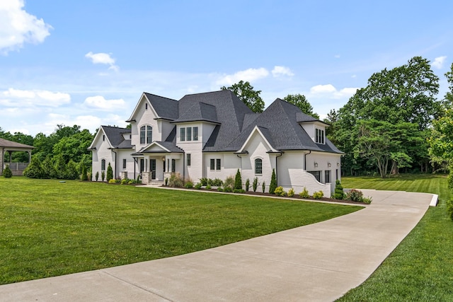 4617 Delta Springs Ln, Franklin, TN 37064 - french country inspired facade with a front yard, roof with shingles, and concrete driveway