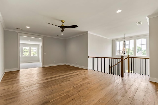 4617 Delta Springs Ln, Franklin, TN 37064 - empty room with crown molding, light wood-style flooring, a chandelier, recessed lighting, and ceiling fan