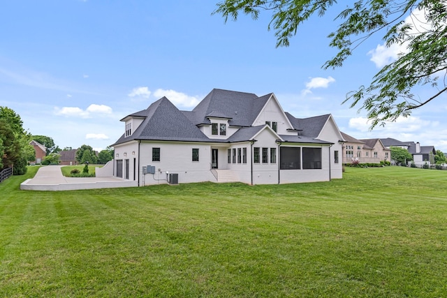 4617 Delta Springs Ln, Franklin, TN 37064 - back of property with a lawn, a sunroom, central air condition unit, a garage, and roof with shingles