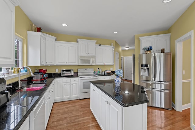 6769 Cold Stream Dr, Nashville, TN 37221 - kitchen with white appliances, a sink, white cabinets, dark countertops, and light wood-style flooring